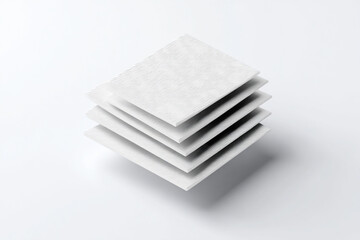 Stack of clean white napkins on plain background