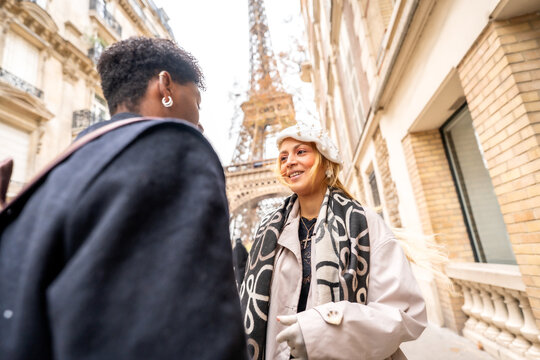 Couple enjoying romantic street discussion in paris