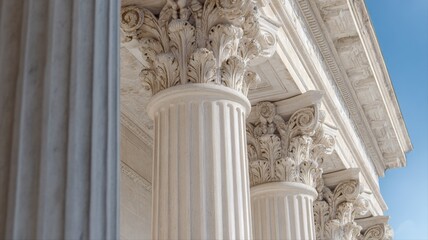 Fototapeta premium Architectural Columns with Ornate Capitals and Blue Sky Background, Symbolizing Justice, Governance, and Historical Significance