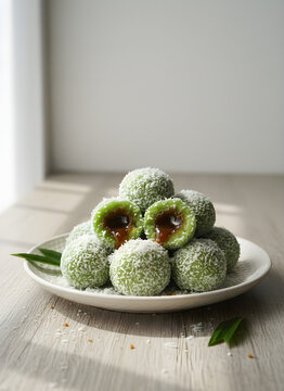 Realistic illustration of klepon, green pandan glutinous rice balls filled with melted palm sugar, coated in grated coconut flake