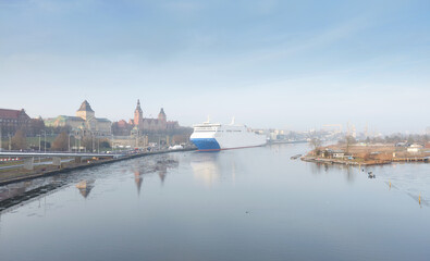 Panorama of Szczecin waterfront with a ferry moored at the Odra River quay, Poland. © MaciejBledowski