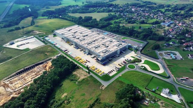 Aerial view of industrial building and surrounding landscape in rural area
