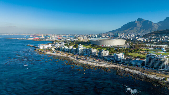 Aerial cityscape of Cape Town with stadium, coastline and Table Mountain
