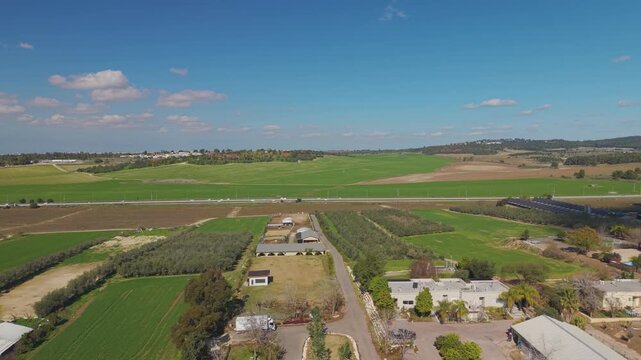 Route 3 near Tal Shahar moshav with vast agricultural fields and the nearby community of Mishmar David visible in the panoramic landscape