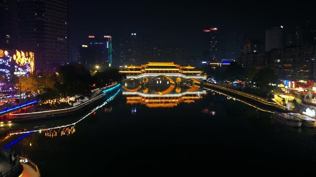 Flying Over Jin River Towards The Anshun Bridge At Night In Chengdu, Sichuan, China. - aerial shot
