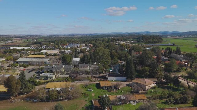 Moshav Tal Shahar from above, showcasing the peaceful rural life and Mediterranean landscape of the Judean foothills under a clear blue sky