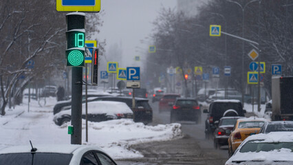 Winter traffic lights. Frost, snowfall on roads, collapse, traffic jams and congestion. A snowstorm is wreaking havoc on city life. High quality photo