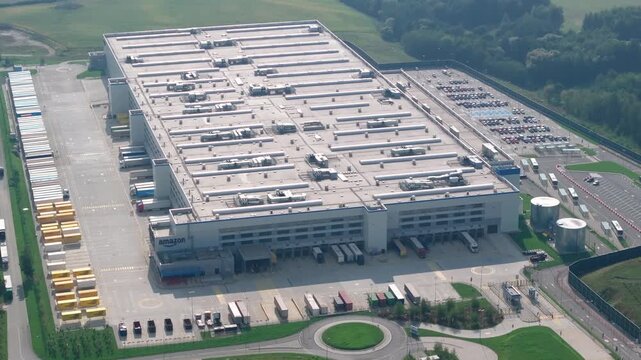 Amazon fulfillment center overview with delivery trucks and loading docks