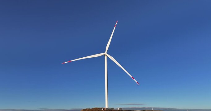 A wind turbine wind-powered electrical generators kinetic energy of wind into electrical energy network technology digital background connection