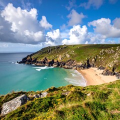 Scenic coastal view with sandy beach, cliffs, turquoise water, and bright blue sky with fluffy white clouds