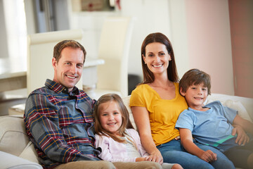 Obraz premium Smile, relax and portrait of family on sofa in home for bonding, support and connection. Love, happiness and lounge with parents and children in living room for care, commitment and trust together
