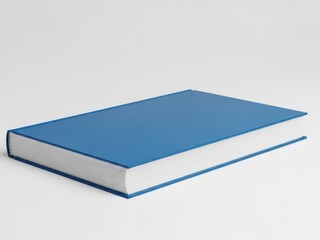 A single blue book resting on a plain surface