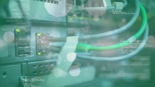 Animation of lens flares, circles, computer language against back panel of machinery and with wires