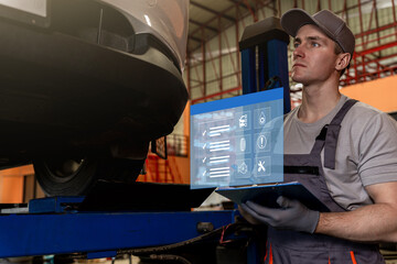 Mechanic check list to the clipboard insurance with inspecting car at garage workshop.