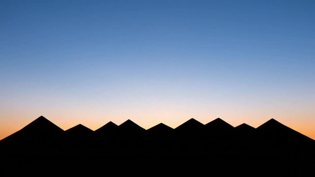 silhouette of multiple mountain range at sunset with vibrant blue and orange gradient sky for travel and landscape photography commercial usage