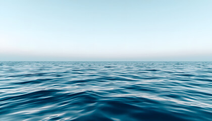 Obraz premium Minimalist landscape of calm blue ocean waves under a clear sky during morning soft light