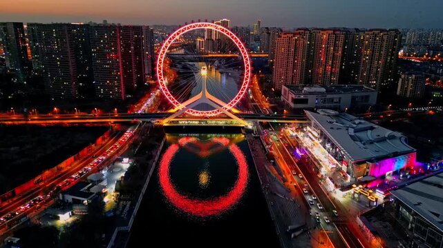 Aerial view of the vibrant Tianjin Eye ferris wheel reflected in the river, creating a mesmerizing contrast against the city's skyline, Tianjin, Tianjin, China.