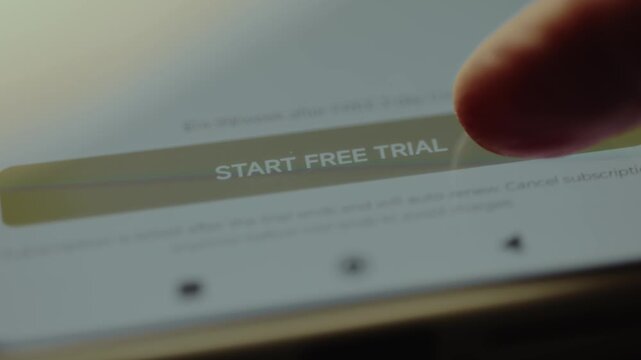Finger taps the Start Free Trial option on a smartphone screen