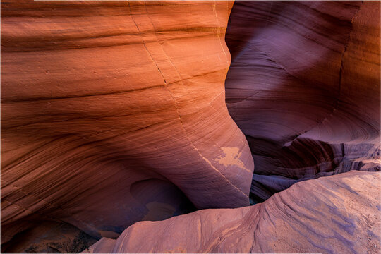 View of smooth canyon walls carved by time, showcasing nature's artistry in layered rock formations and subtle color gradients, Escalante, Utah, United States.