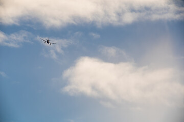 Fototapeta premium Jet Plane Disappearing into the Sky