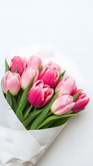 Vibrant Pink Tulip Bouquet Wrapped in White Paper