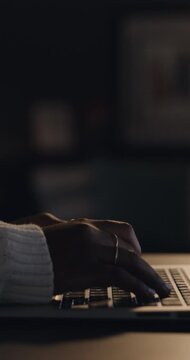 Typing, night and hands of person on laptop for copywriting, editing and article review in home. Remote work, journalism and woman on computer keyboard for publishing, news report and research