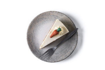 Carrot cake slice with cream cheese frosting isolated on white background. Top view