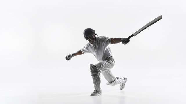 Professional cricket batsman powerful attacking shot isolated on white background. Concept of cricket training materials, sports advertising, athlete performance promotion and coaching content - Powered by Adobe