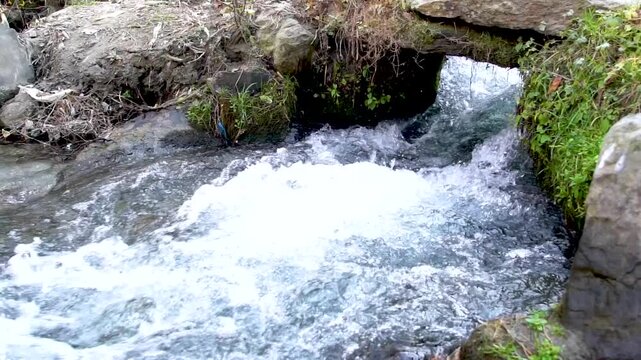 Slow motion shot of water fall splashes in hilly area of Pakistan	
