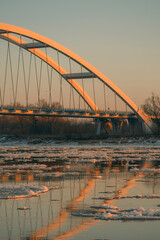 Fototapeta premium View of Gen. Elżbieta Zawacka's bridge in Toruń at sunset