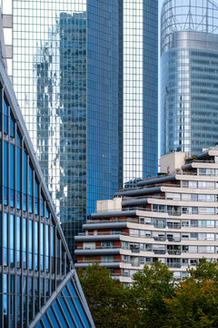 Urban skyline of corporate glass skyscraper district with greenery in La Defense Paris architecture for documentary editorial travel context