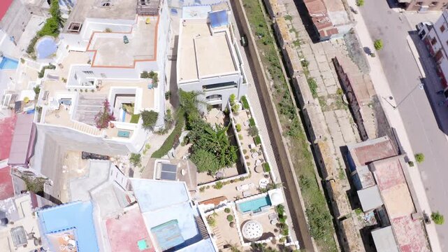 Assilah, Morocco &ndash; May 8, 2024: Orbit drone shot around a riad in the heart of the old Medina, highlighting its traditional architecture and courtyard.