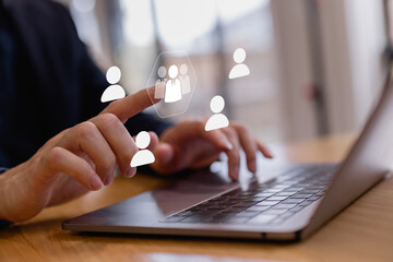 representing human resources management, recruitment, team selection, digital workforce, and online people management system.Business professional selecting user profiles on laptop interface