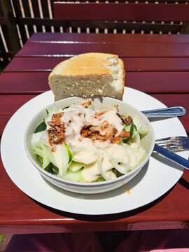 A cucumber salad with bread