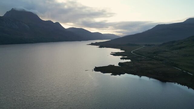 Drone shot looking down over the islands and waters of Loch Maree in northwest Scotland.