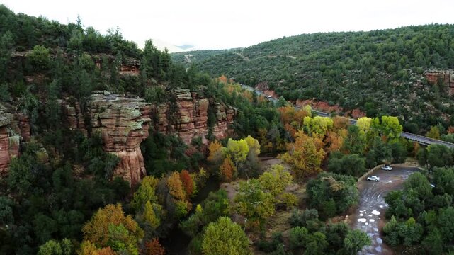 Drone shot over Arizona's lush forest surrounding the East Verde River near Payson, Arizona.