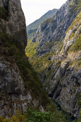 Fototapeta premium Vertical mountain landscape features towering rocky cliffs