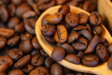 Coffee beans background with rich brown tones and natural texture. Roasted coffee beans close-up, creating a warm and aromatic backdrop ideal for coffee shops, cafes, menus, packaging, branding, food 