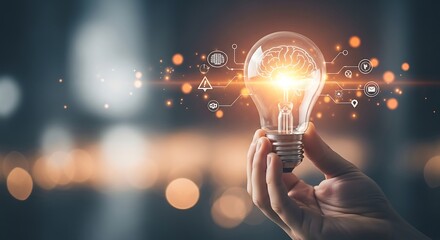 Creative Smart Thinking Concept &ndash; Hand Holding Virtual Lightbulb with Brain on Bokeh Background.