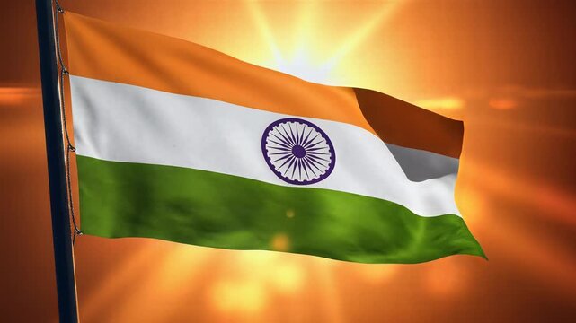 Indian flag waving in the wind against a vibrant orange sky in india