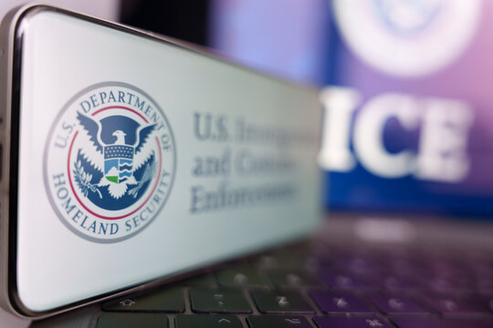 Smartphone screen displaying U.S. Immigration and Customs Enforcement ICE logo and Department of Homeland Security seal.