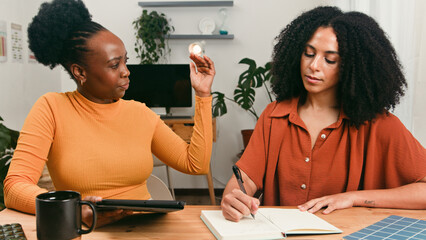 Diverse Startup Team Collaborates At Table During Creative Brainstorm Session In Bright Office
