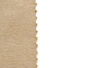 Fototapeta premium A clean banner for your text from a recycled cardboard with a jagged edge on white background 