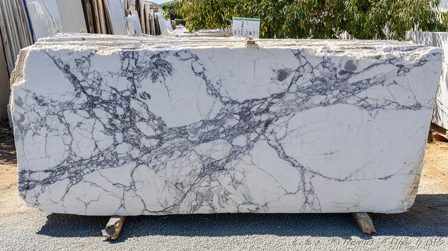 slab. Large cut slab of Carrara marble showing intricate grey veins and texture. safety posters, maintenance manuals, designed for precision metalworking and fabrication facilities.
