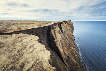Cracked geological fault pattern in dry surface landscape with dramatic textures and lighting, generative ai