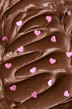 Chocolate hazelnut spread with heart spirnkles. Full frame pattern. Top view