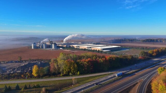 Industrial poultry processing plant producing steam next to Interstate 96, Lake Odessa, Michigan, USA