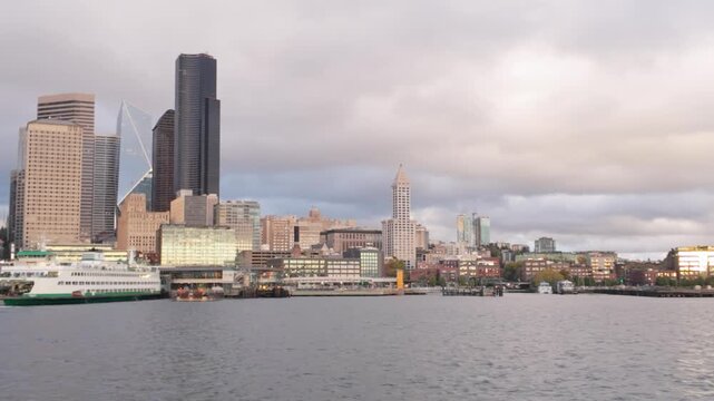 Gimbal wide panning shot of the Seattle waterfront as seen from a moving boat on Elliott Bay in the Puget Sound, Washington. 4K at 30 FPS
