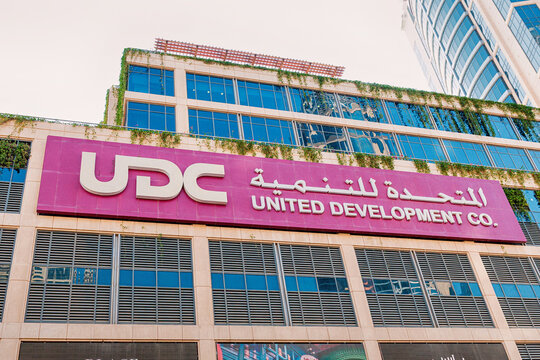 30 November 2025, Doha, Qatar: United Development Company logo sign on the exterior of its modern corporate office building in The Pearl