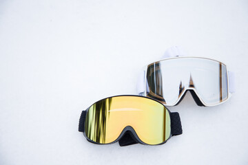 Ski goggles on the snow. Winter sports concept.